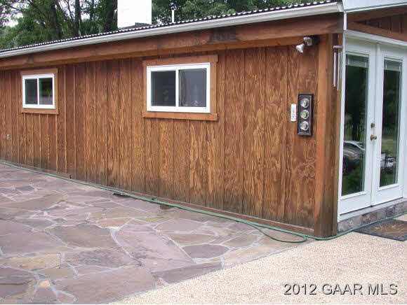 792 Stribling Springs Road Mount Solon, VA 22843 - Photo 8 of 9 a view of backyard with door and wooden floor