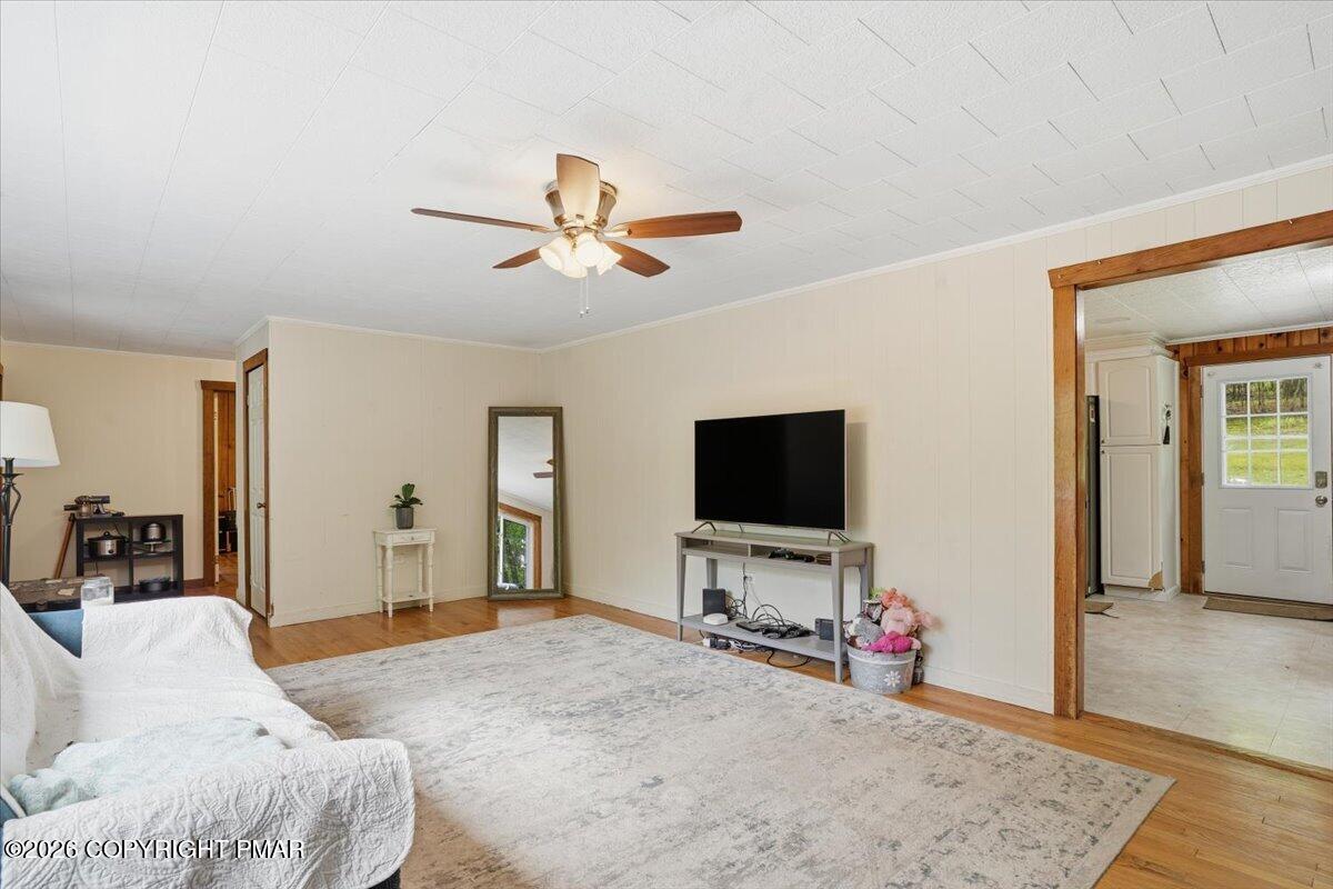 232 Garrity Road Hawley, PA 18428 - Photo 19 of 57 a bedroom with furniture and a flat screen tv