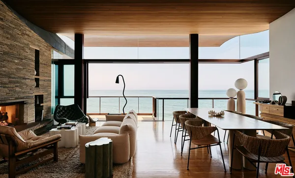 a view of a dining room with furniture and window