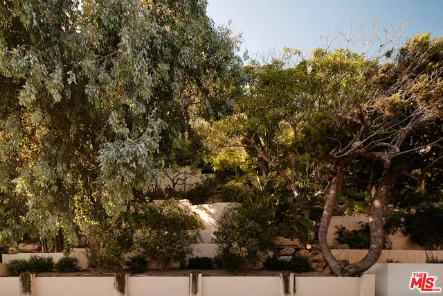 a view of balcony with couches and ocean view