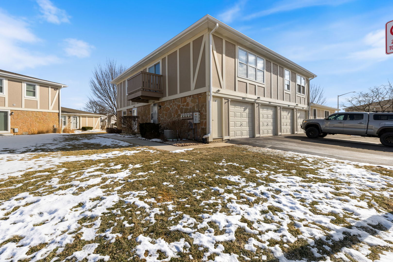 1055 Hampton Harbor, Unit 1055 Schaumburg, IL 60193 - Photo 1 of 14 a view of a street in front of a building