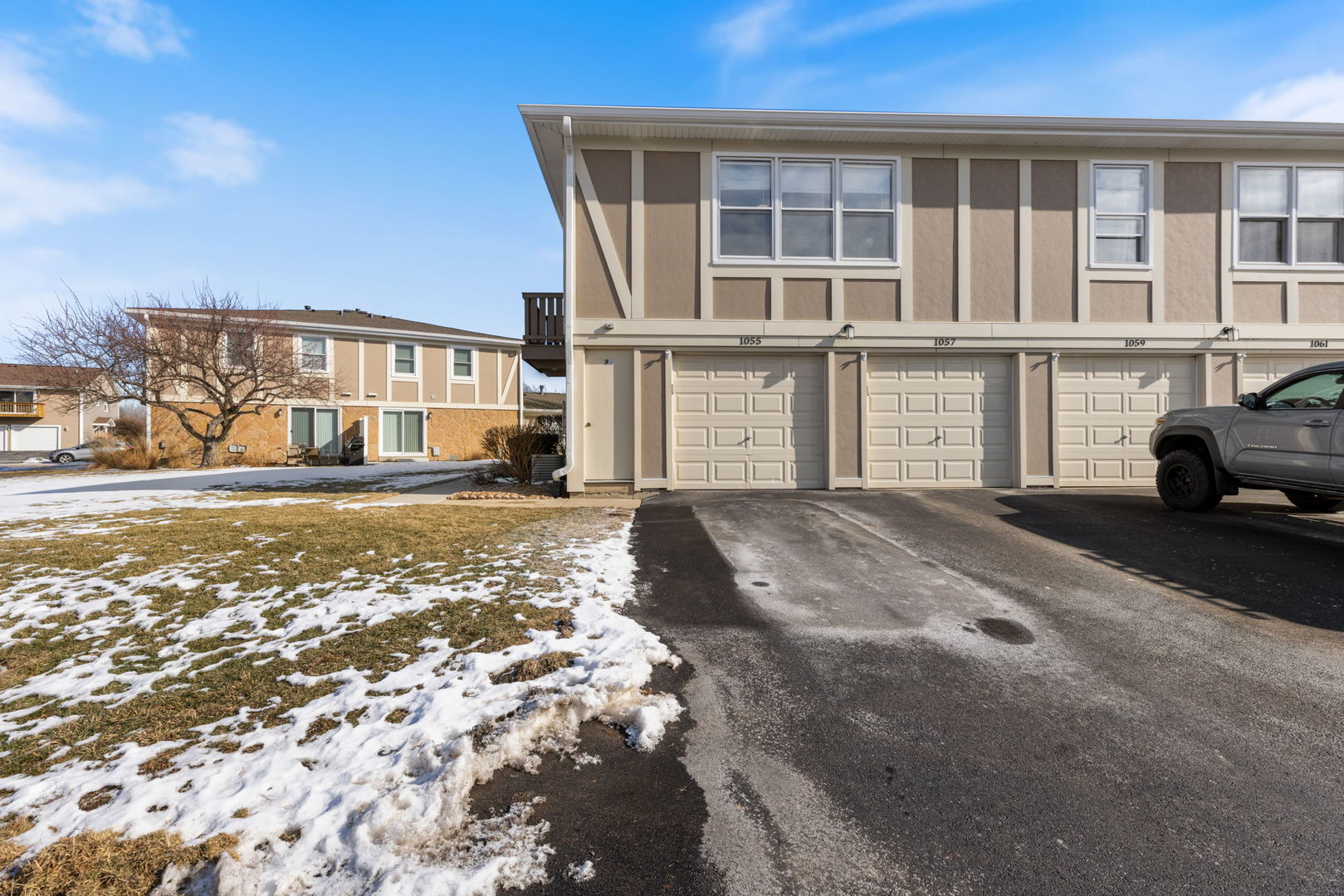 1055 Hampton Harbor, Unit 1055 Schaumburg, IL 60193 - Photo 2 of 14 a view of a house with a large window and yard