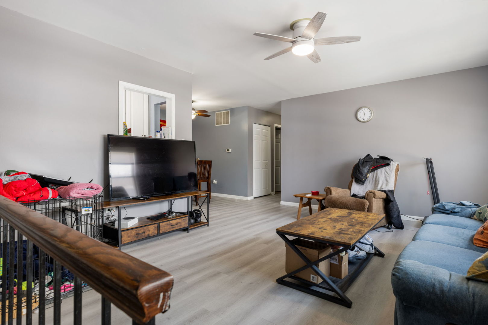 1055 Hampton Harbor, Unit 1055 Schaumburg, IL 60193 - Photo 6 of 14 a living room with furniture and a flat screen tv