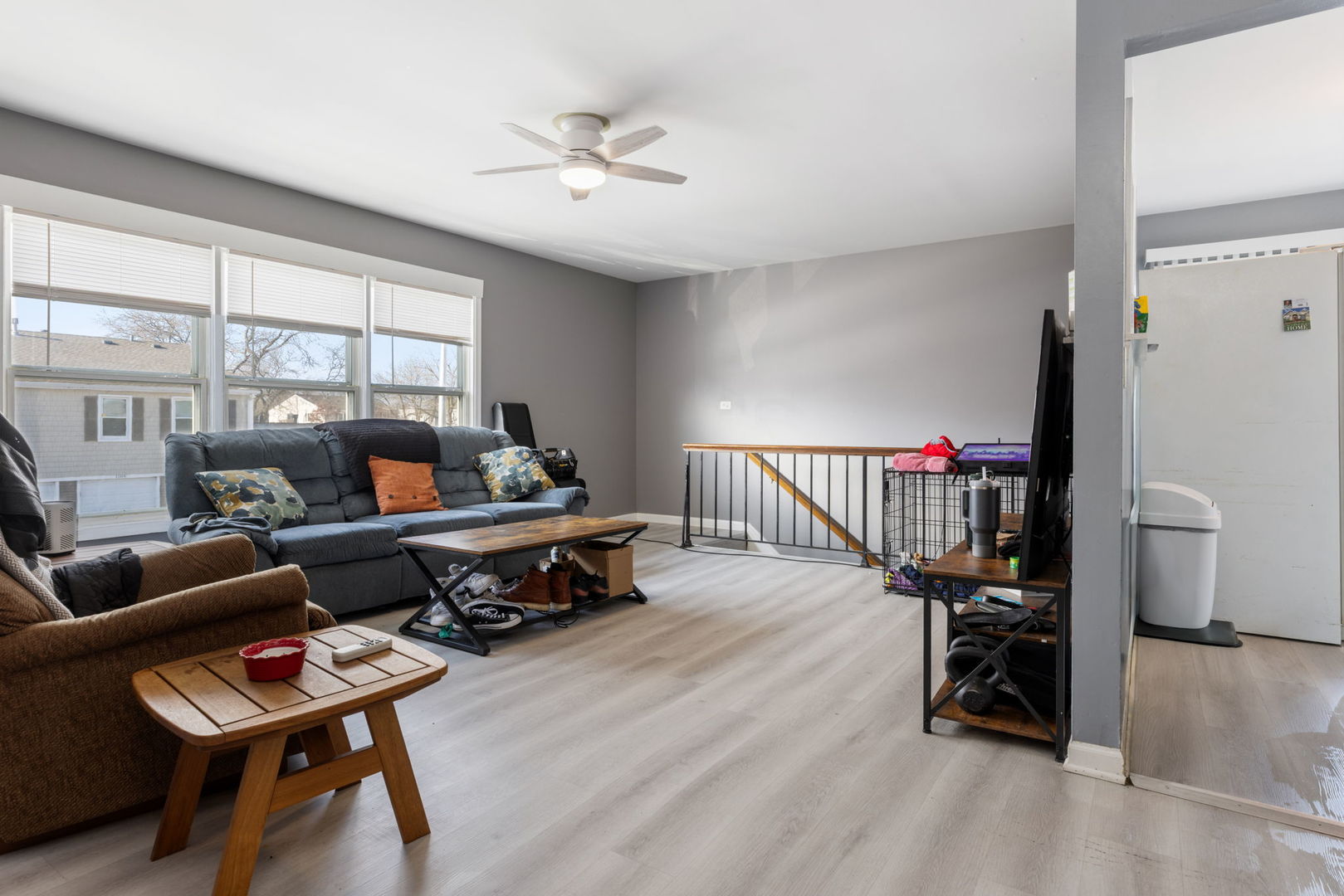 1055 Hampton Harbor, Unit 1055 Schaumburg, IL 60193 - Photo 7 of 14 a living room with furniture and a wooden floor