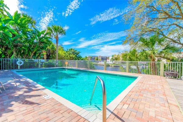 a view of a swimming pool with a yard