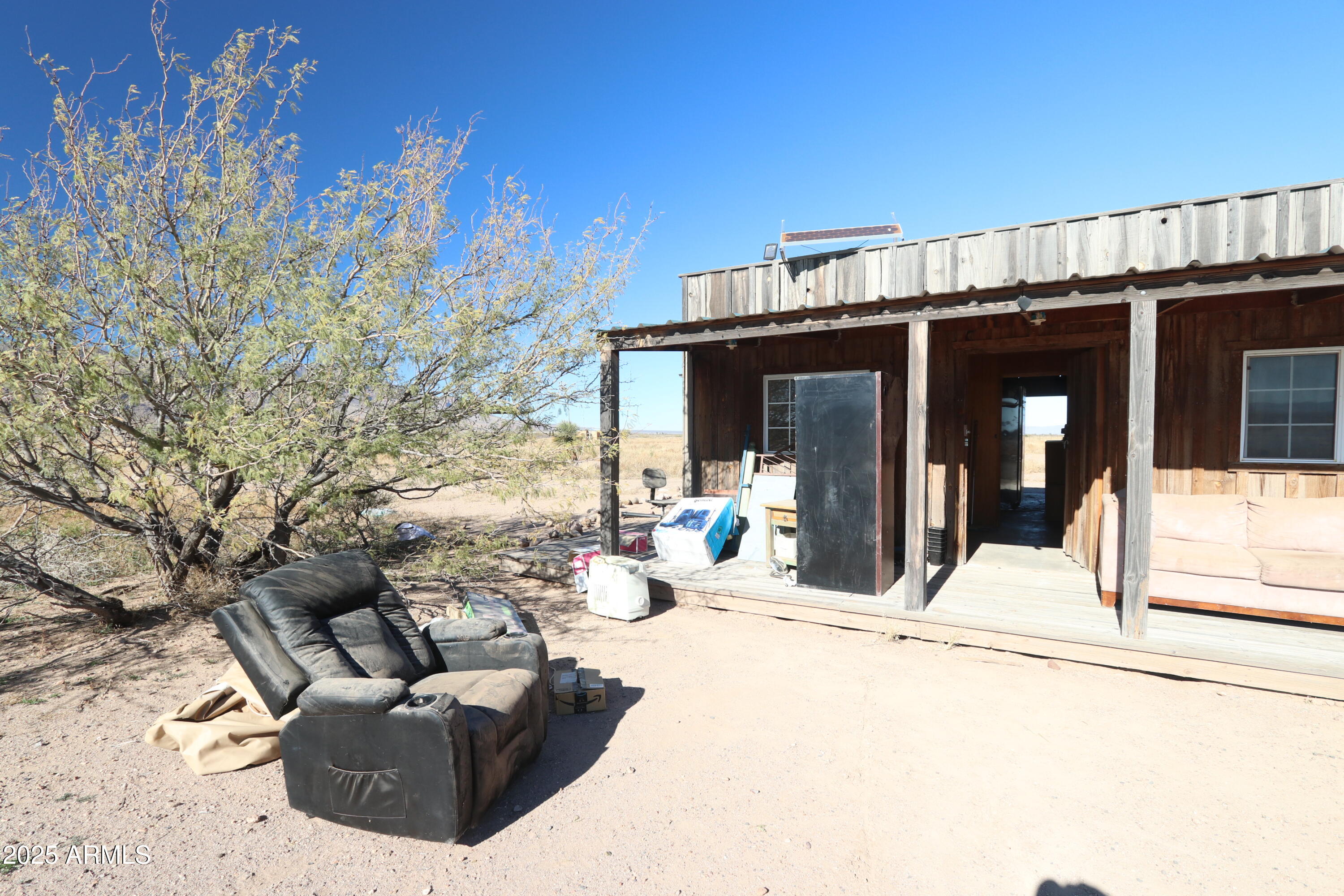 11730 North Hideout Ranch Road San Simon, AZ 85632 - Photo 2 of 14 a view of a couches and dinning table in patio