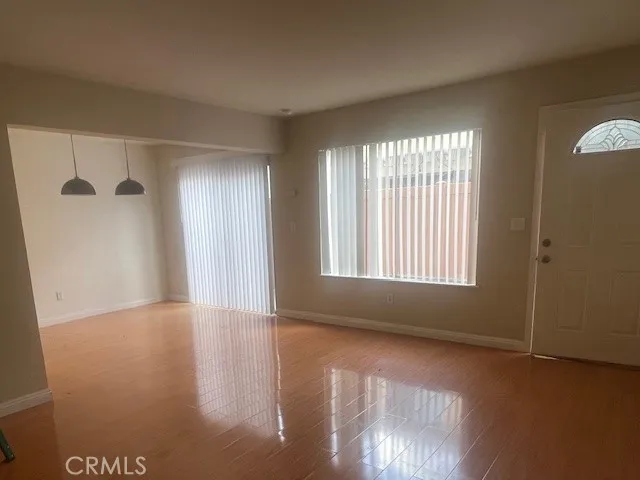 a view of an empty room with glass door