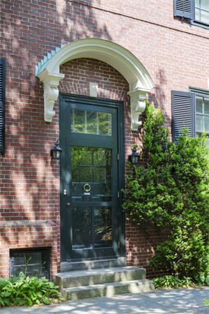 22 Worthington Road Brookline, MA 02446 - Photo 5 of 8 a front view of a building with garden