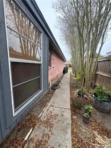 a front view of a house with basket ball court