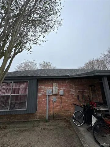 a view of a backyard with plants and trees