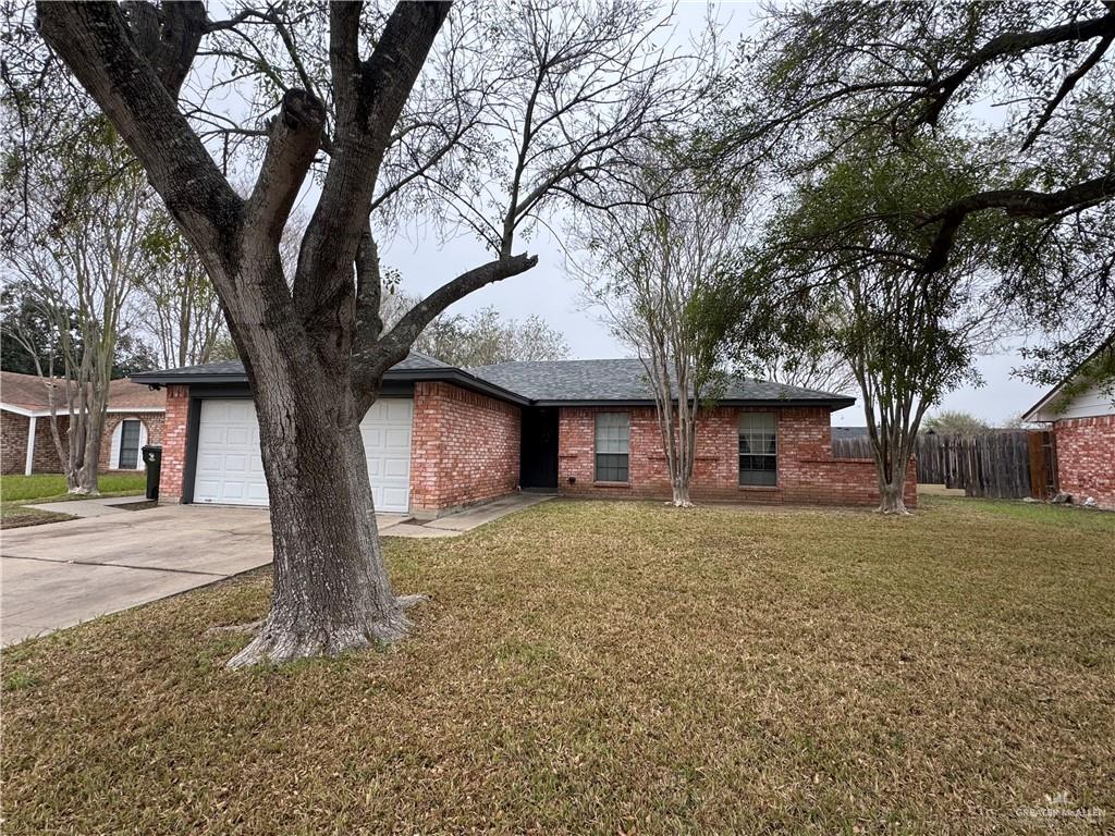 2018 West Adrian Street Harlingen, TX 78552 - Photo 3 of 13 a tree in front of a white house