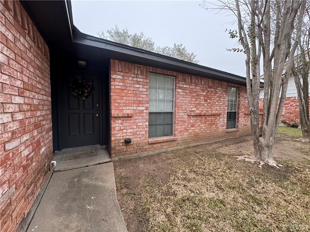 2018 West Adrian Street Harlingen, TX 78552 - Photo 4 of 13 a front view of a house with parking space
