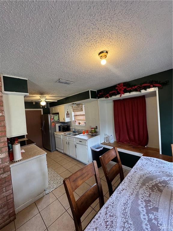 2018 West Adrian Street Harlingen, TX 78552 - Photo 7 of 13 a kitchen with a sink and a stove top oven