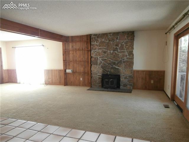 2870 Valencia Road Colorado Springs, CO 80917 - Photo 7 of 20 Family room/dining room walks out to deck