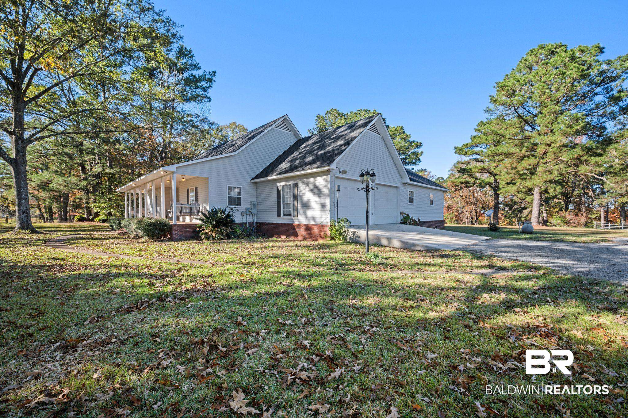 15801 Maytower Road Bay Minette, AL 36507 - Photo 2 of 43 View of home's exterior featuring a porch and a yard