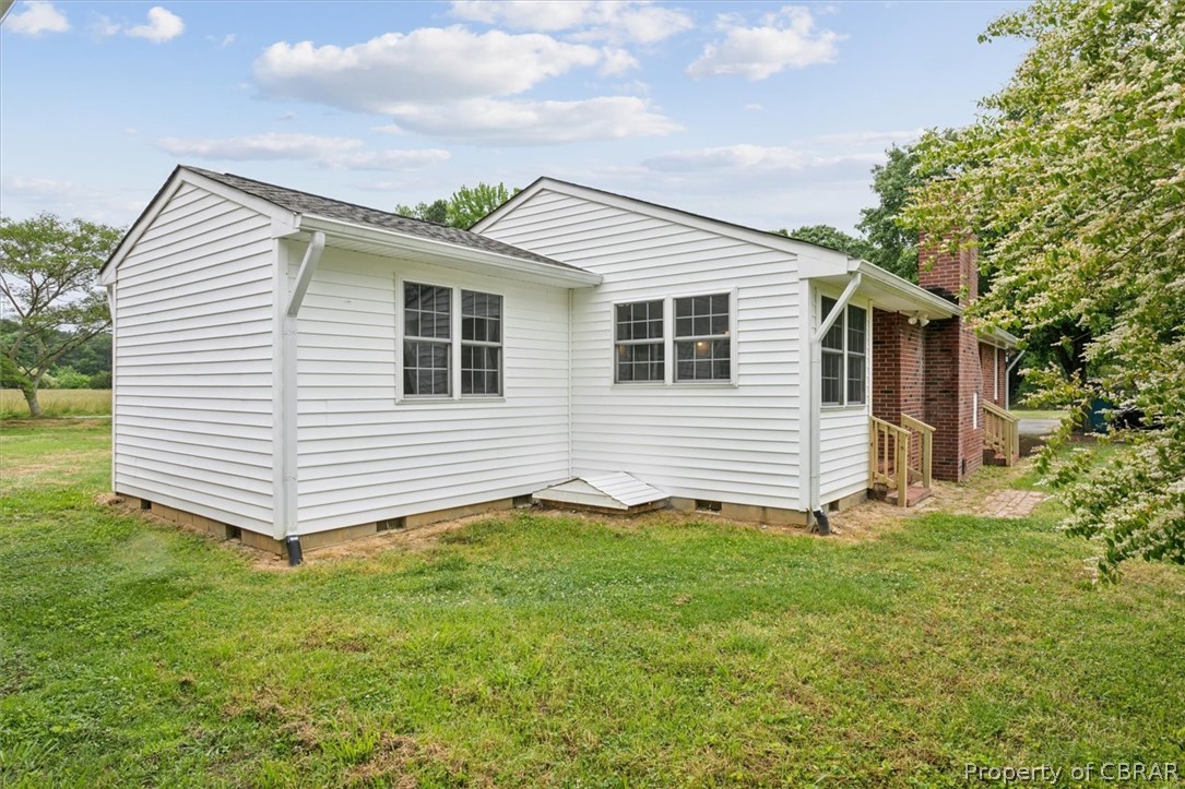 9040 Diascund Road Lanexa, VA 23089 - Photo 32 of 37 View of home's exterior featuring a lawn