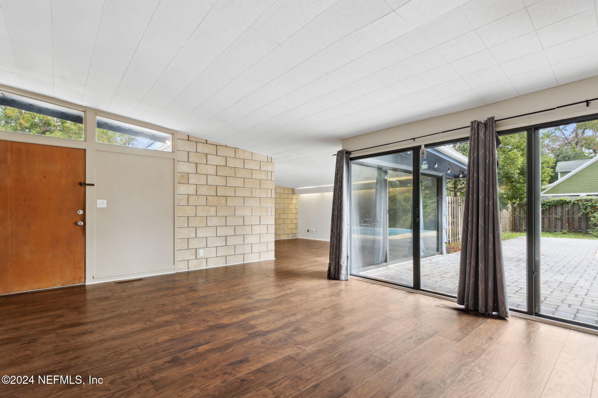 2770 Scott Circle Jacksonville, FL 32223 - Photo 11 of 33 wooden floor in an empty room with a window
