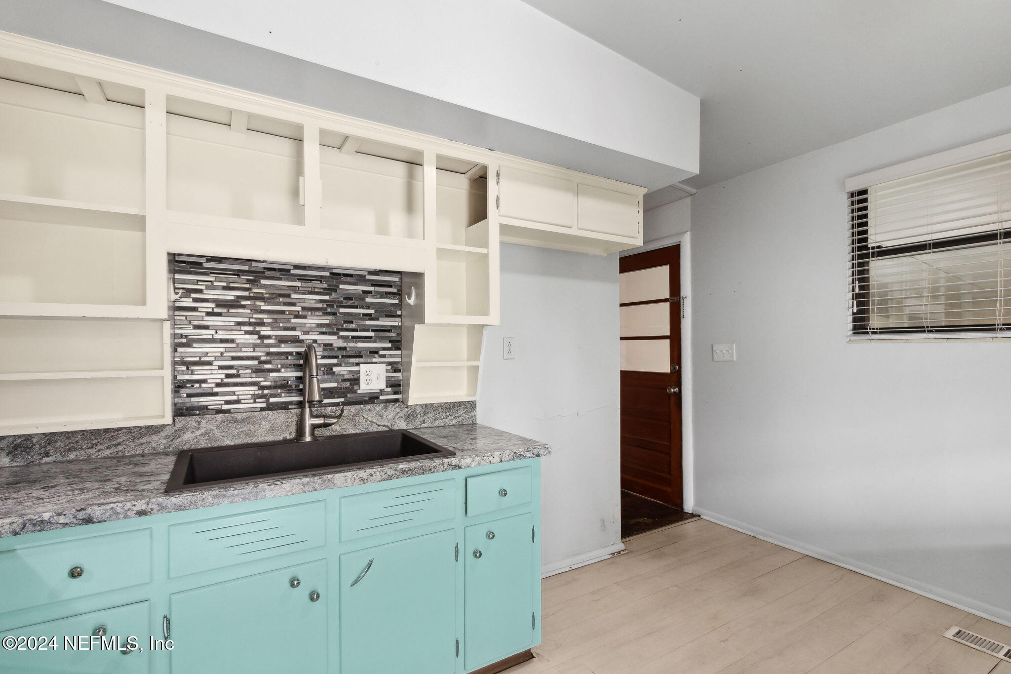 2770 Scott Circle Jacksonville, FL 32223 - Photo 17 of 33 a view of cabinets and window