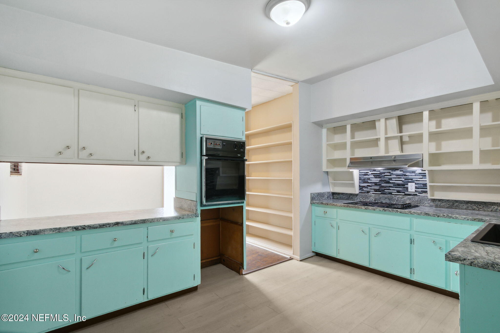2770 Scott Circle Jacksonville, FL 32223 - Photo 18 of 33 a kitchen with cabinets and window