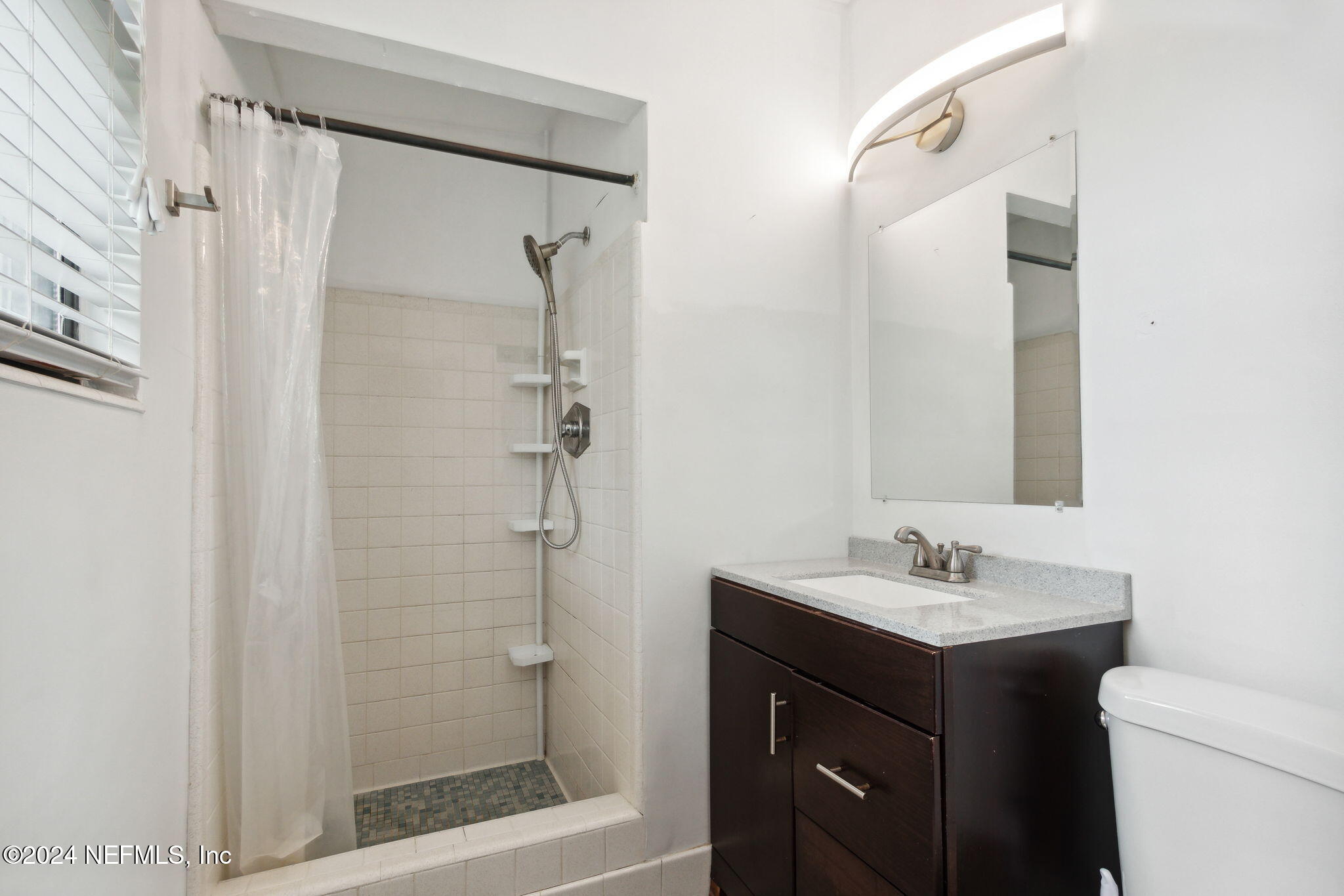 2770 Scott Circle Jacksonville, FL 32223 - Photo 21 of 33 a bathroom with a sink a toilet and shower