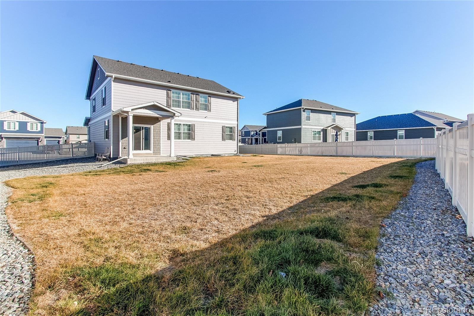 10099 Cascade Street Firestone, CO 80504 - Photo 39 of 46 a front view of a house with a yard