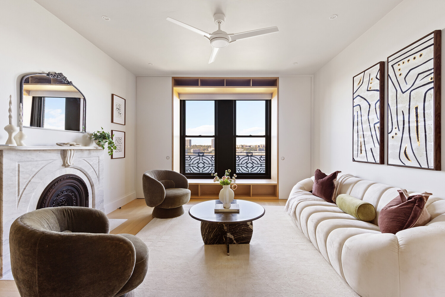 a living room with furniture fireplace and window