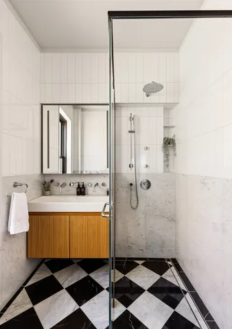 a bathroom with a bathtub and a shower