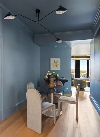 a living room with furniture a flat screen tv and rug floor