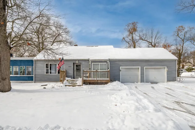 a view of a house with a snow in front of it