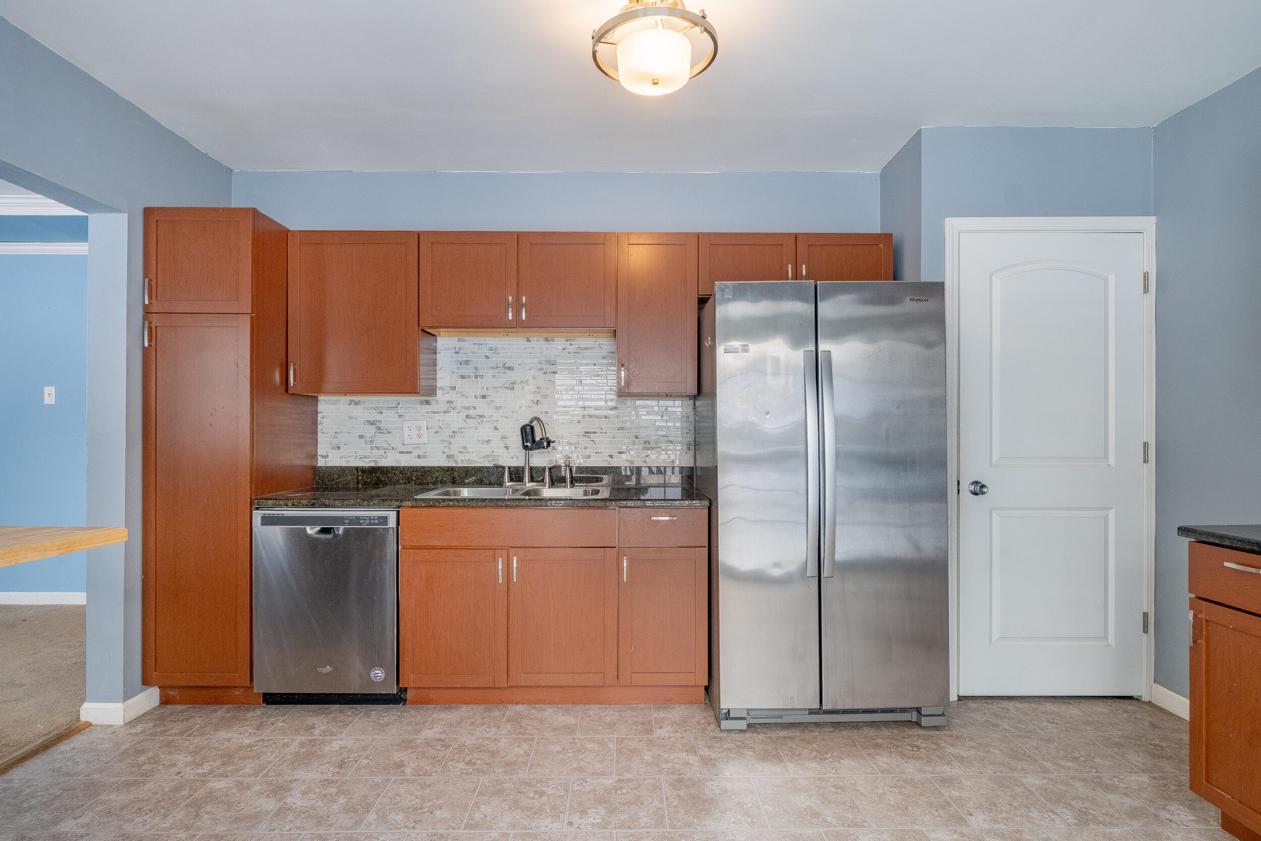 2321 Crest Road Gary, IN 46408 - Photo 11 of 22 a kitchen with stainless steel appliances granite countertop a refrigerator and a stove