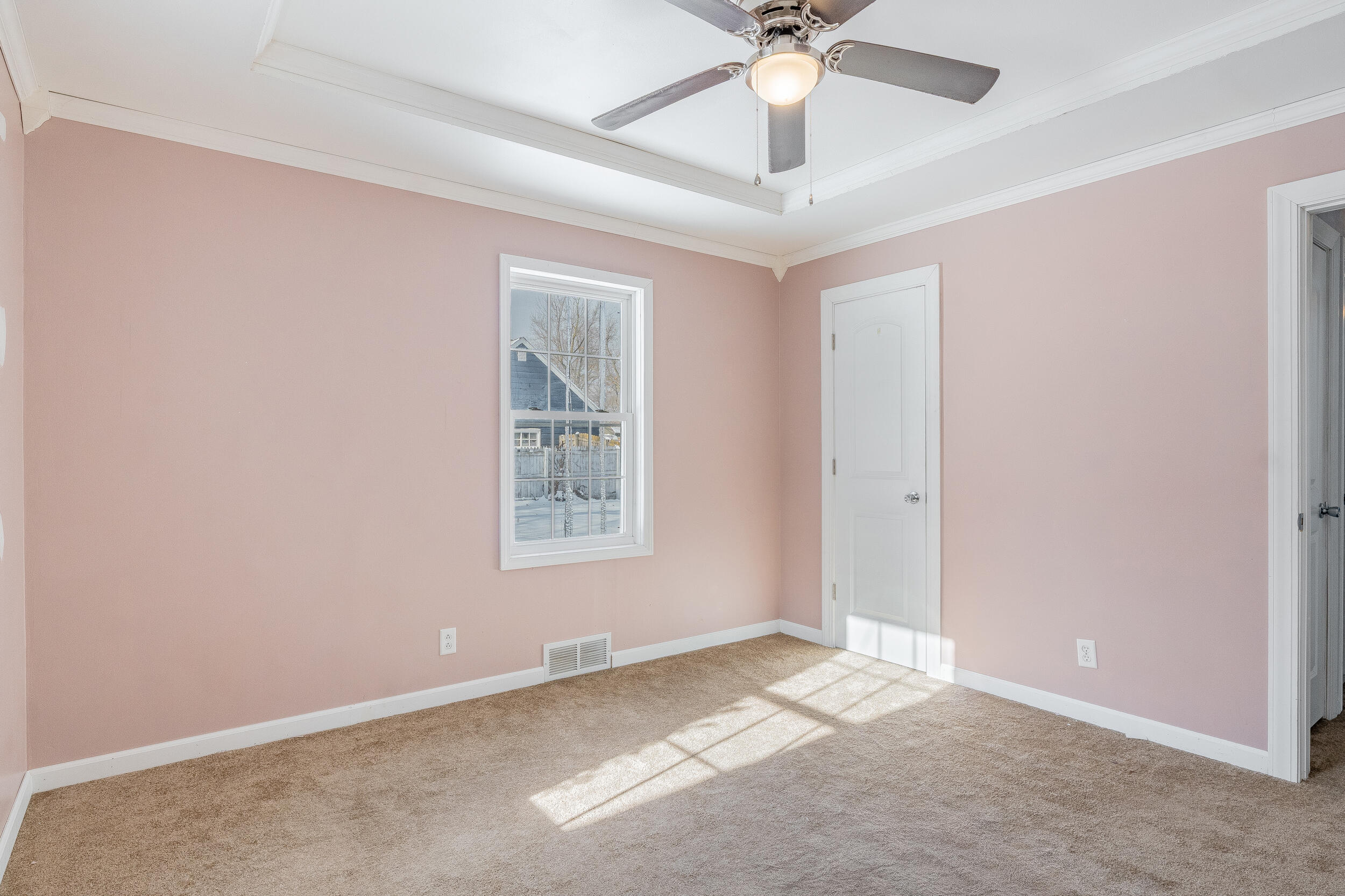 2321 Crest Road Gary, IN 46408 - Photo 14 of 22 an empty room with a chandelier fan and windows