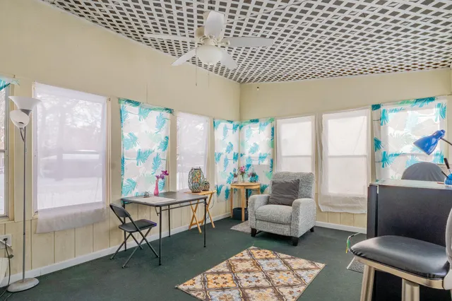 a living room with furniture and a rug
