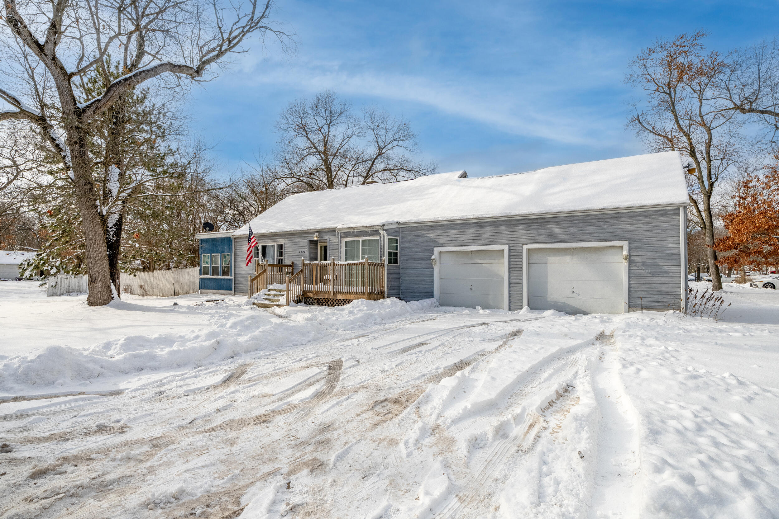 2321 Crest Road Gary, IN 46408 - Photo 2 of 22 a front view of a house with a dirt yard and a large tree