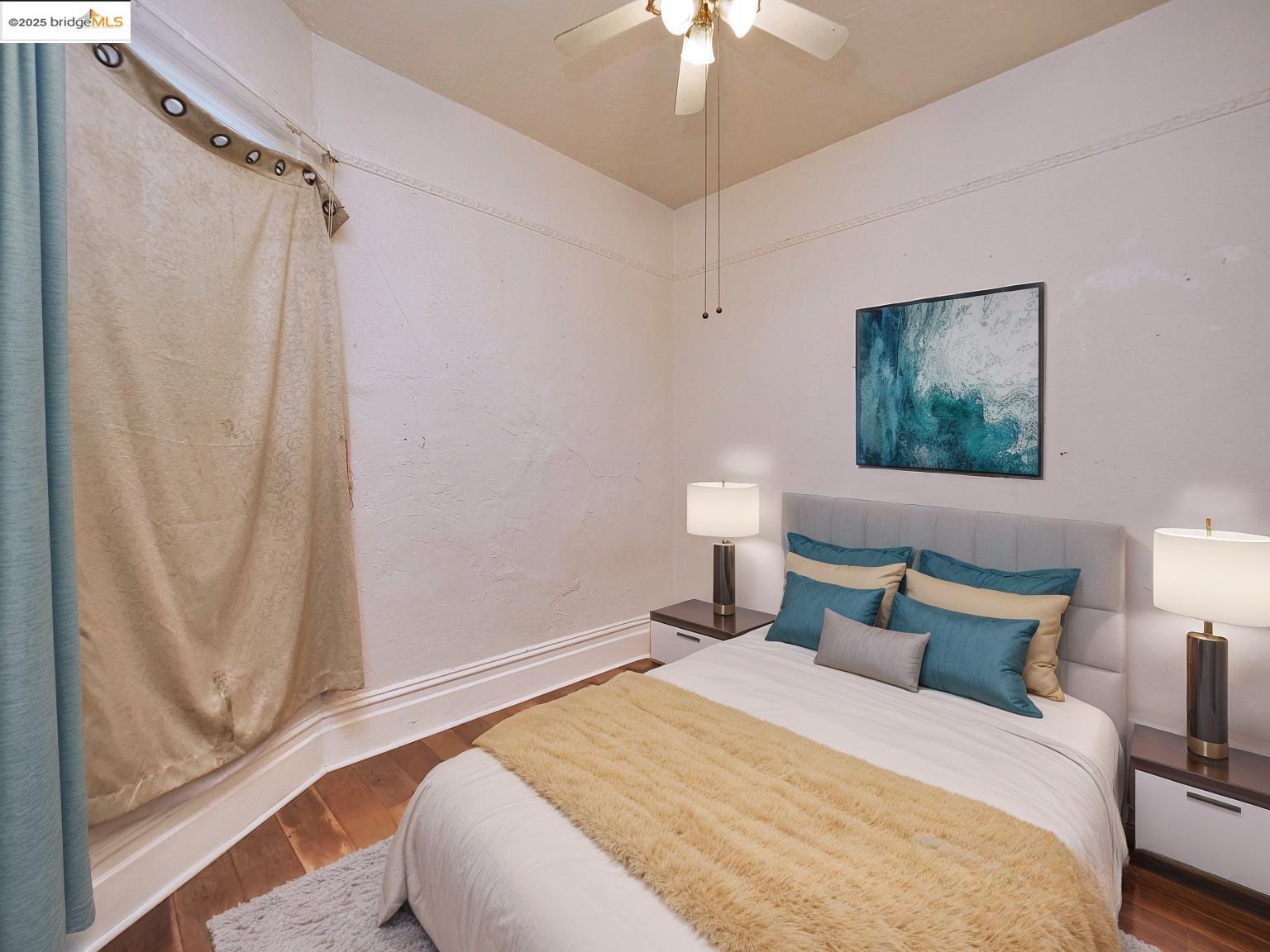 2103 Myrtle Street Oakland, CA 94607 - Photo 13 of 21 a bedroom with a bed and a window