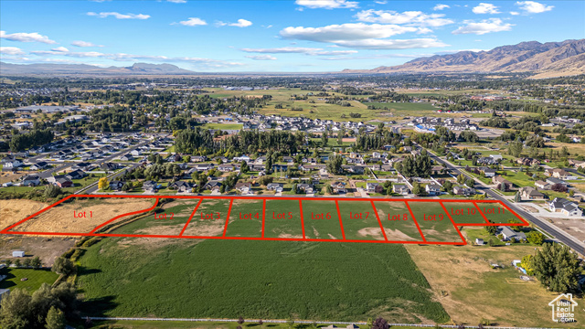 294 West 3400 South, Unit 9 Logan, UT 84321 - Photo 23 of 24 Aerial overview of property's location featuring a mountain backdrop and property parcel outlined
