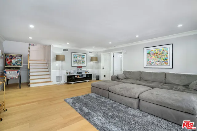 a bedroom with bed and tv