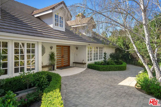 a view of a livingroom with furniture and a large windows
