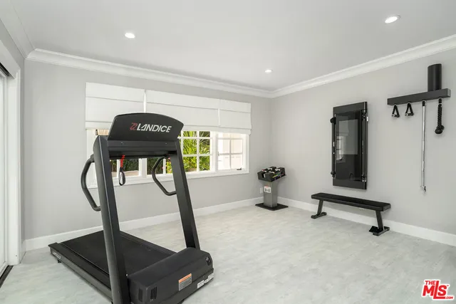 a spacious bathroom with a granite countertop sink toilet a mirror and shower