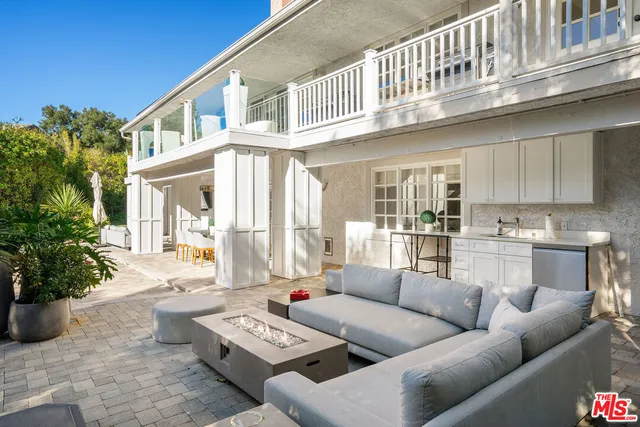 a kitchen with a stove a refrigerator and a sink
