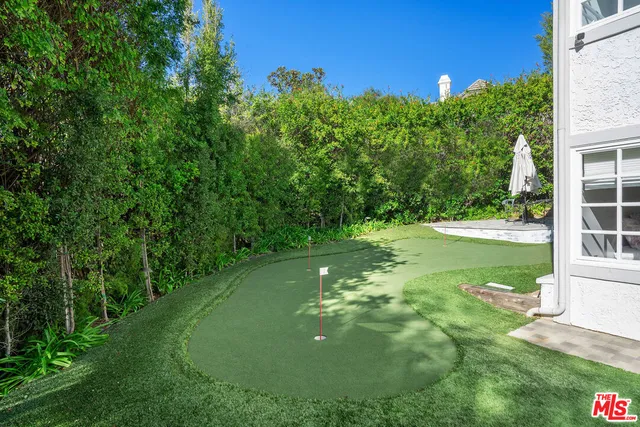 a balcony with table and chairs