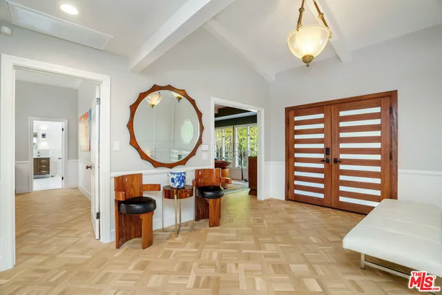 a living room with fireplace furniture and a flat screen tv