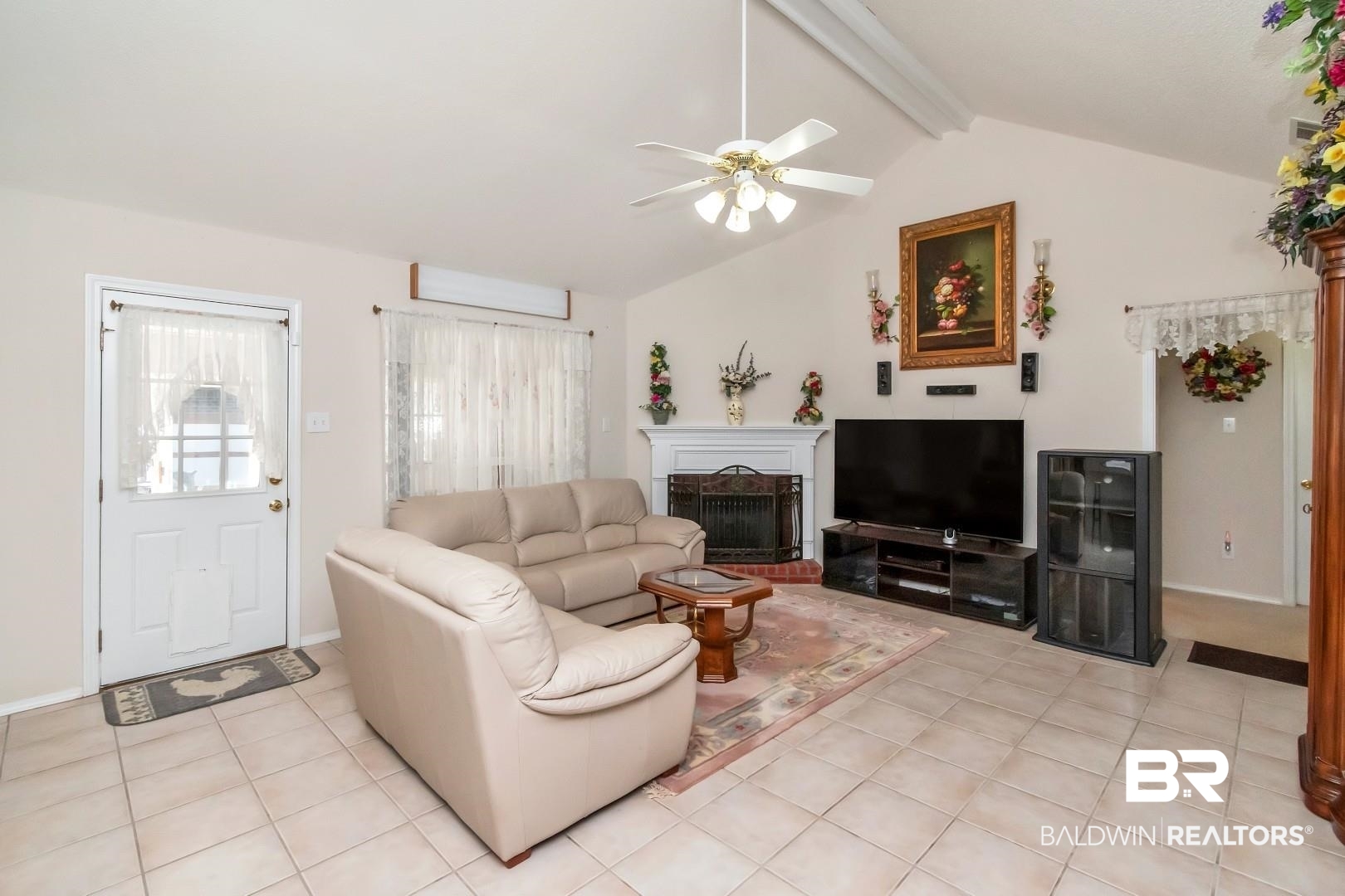 8221 Woodbend Drive Semmes, AL 36575 - Photo 6 of 35 Living room featuring ceiling fan, light tile patterned floors, and lofted ceiling with beams