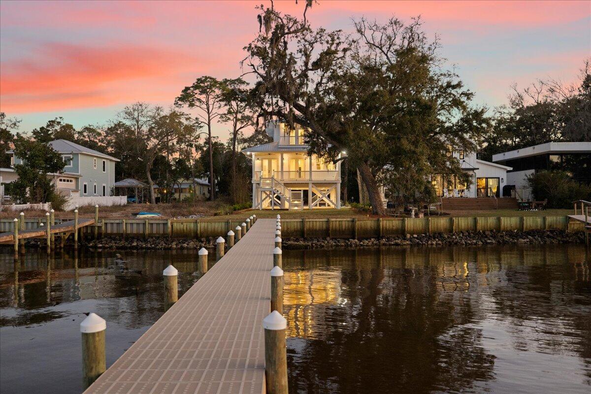 115 Native Tree Lane Santa Rosa Beach, FL 32459 - Photo 1 of 65 a view of a lake with a house