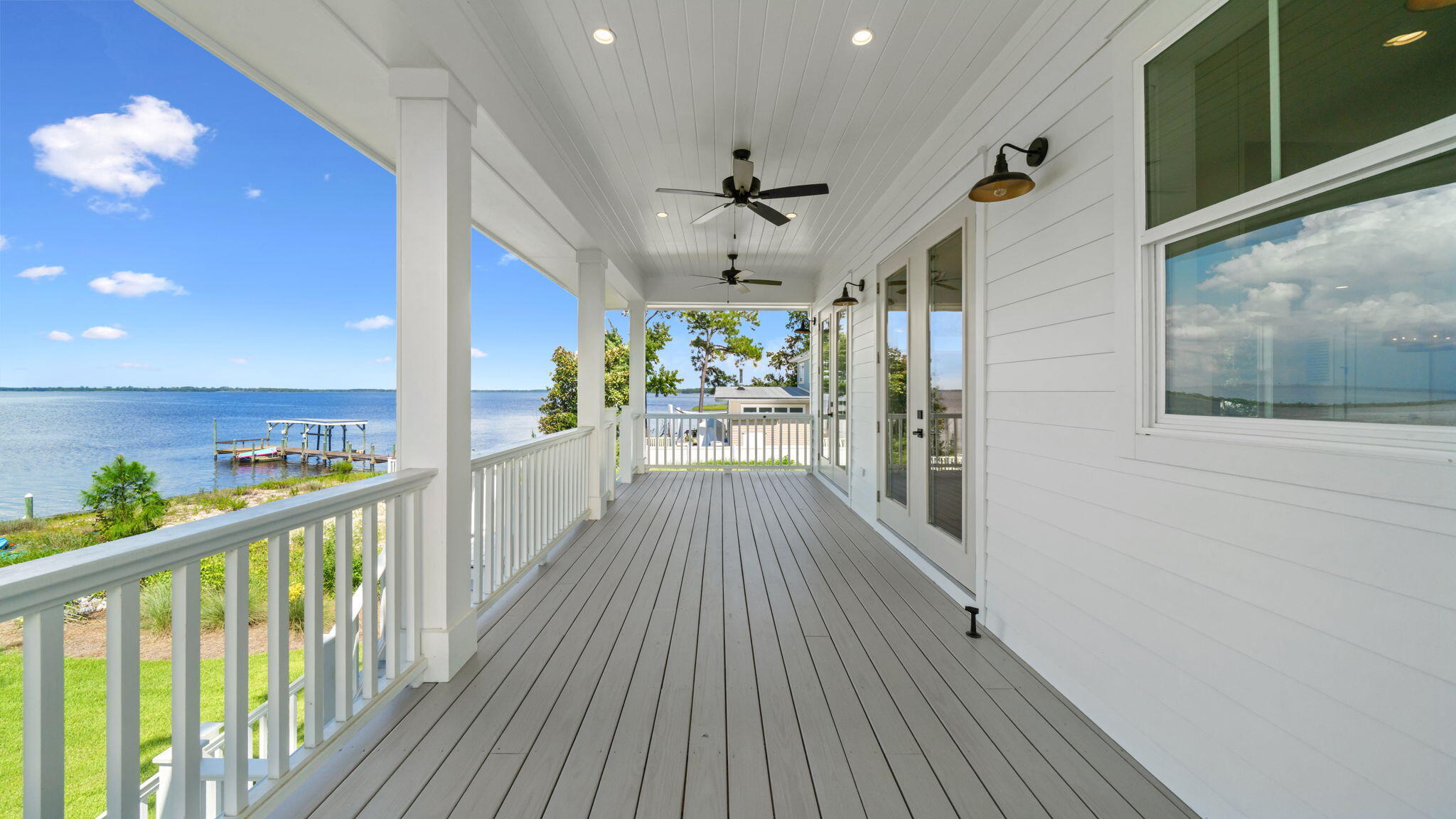 115 Native Tree Lane Santa Rosa Beach, FL 32459 - Photo 22 of 65 a view of a porch with wooden floor