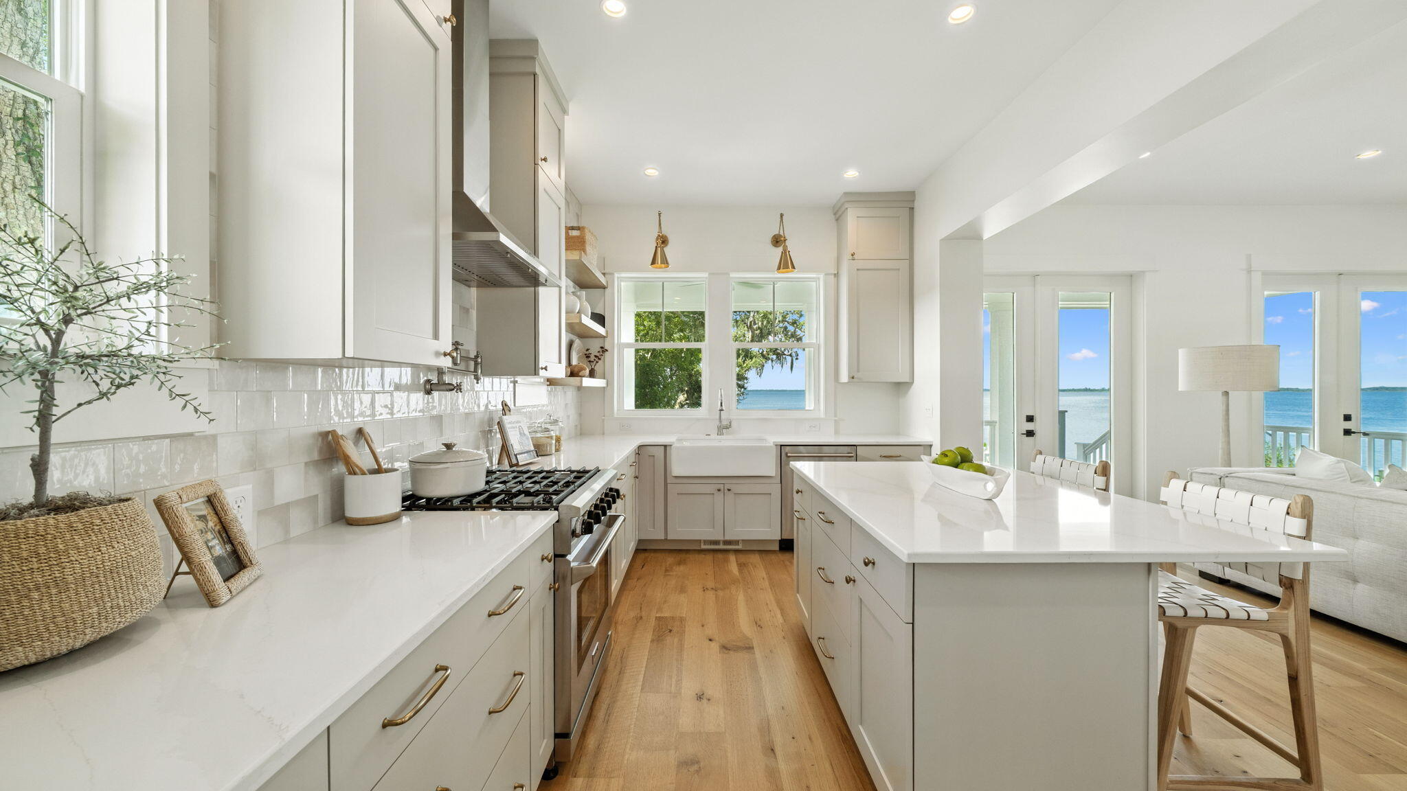 115 Native Tree Lane Santa Rosa Beach, FL 32459 - Photo 24 of 65 a large kitchen with kitchen island granite countertop a sink and a large window