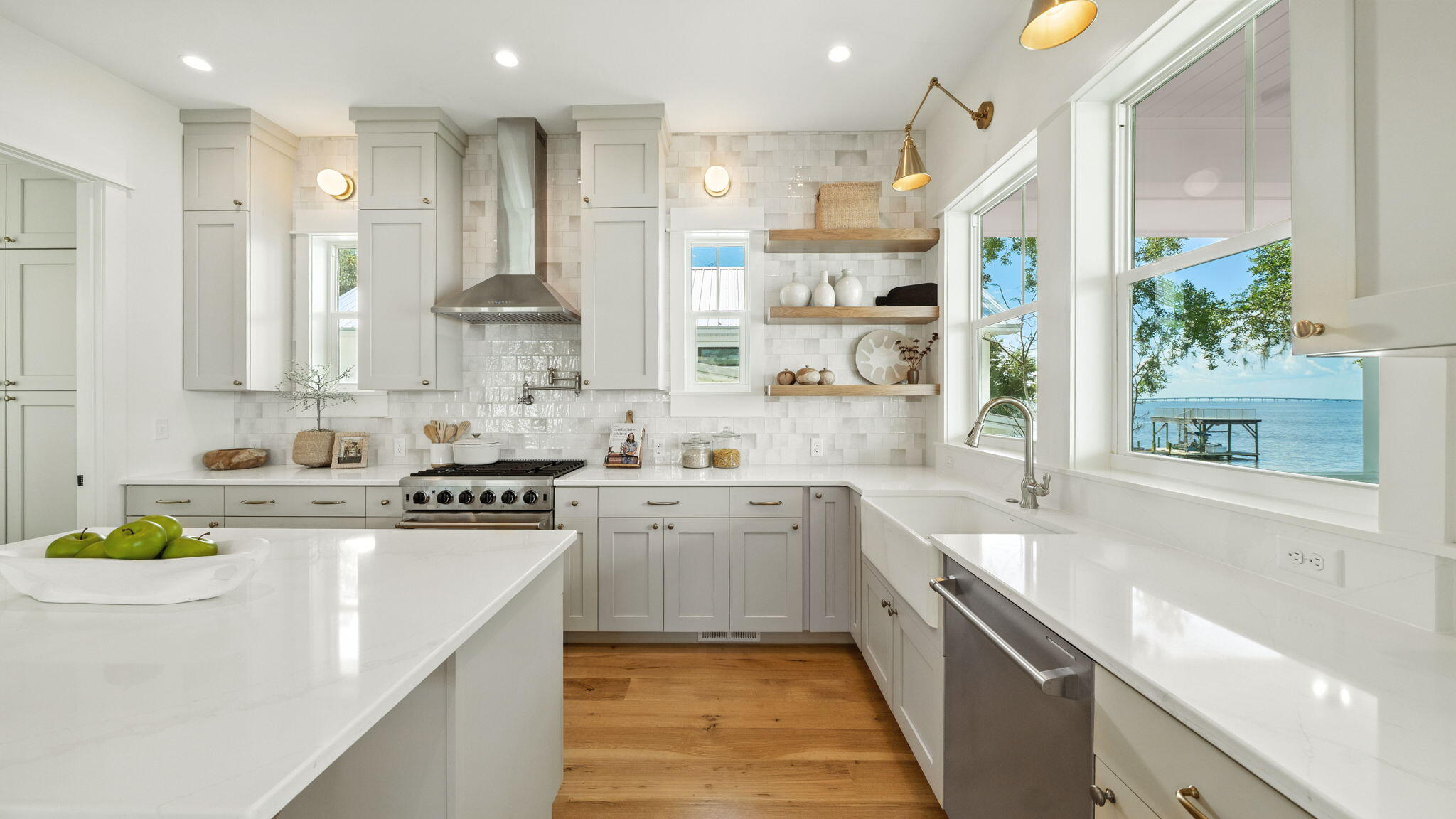 115 Native Tree Lane Santa Rosa Beach, FL 32459 - Photo 25 of 65 a kitchen with stainless steel appliances white cabinets a sink a stove a refrigerator and a window