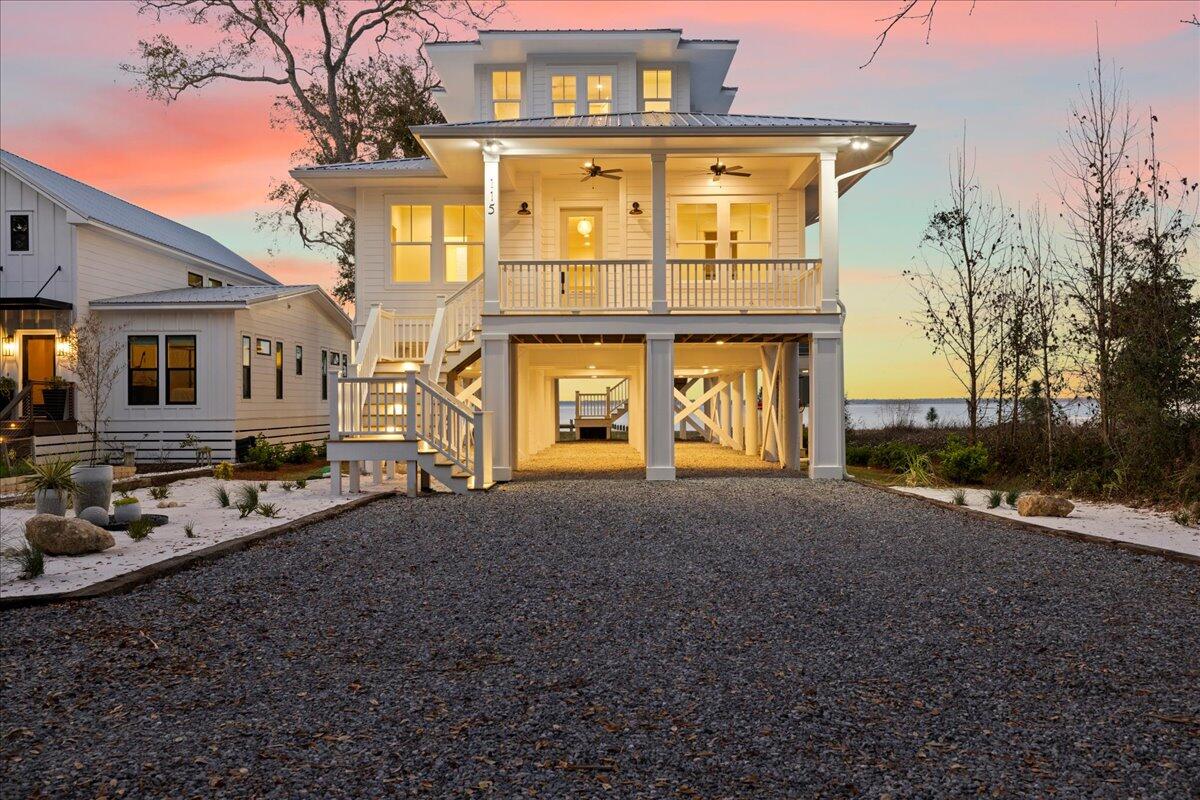 115 Native Tree Lane Santa Rosa Beach, FL 32459 - Photo 3 of 65 a front view of a house with a yard
