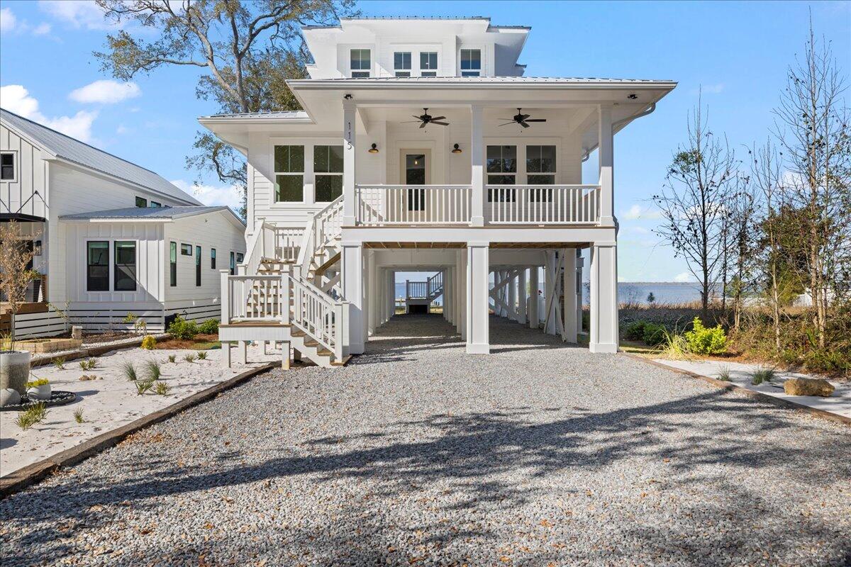 115 Native Tree Lane Santa Rosa Beach, FL 32459 - Photo 52 of 65 a front view of a house with garden