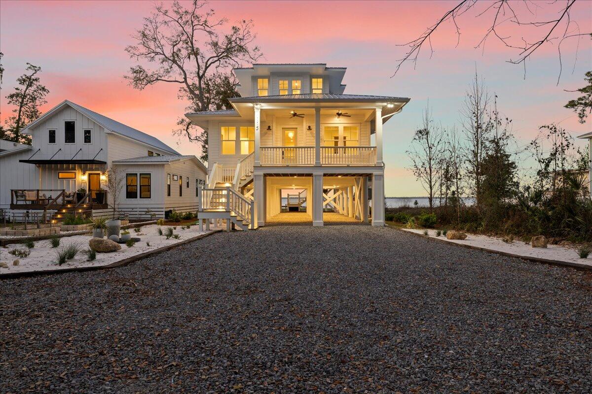 115 Native Tree Lane Santa Rosa Beach, FL 32459 - Photo 56 of 65 a front view of a house with a yard