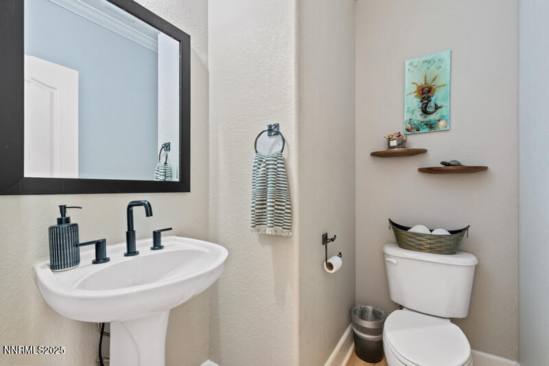 2968 Fox Trail Drive Reno, NV 89523 - Photo 11 of 24 a bathroom with a toilet sink and mirror